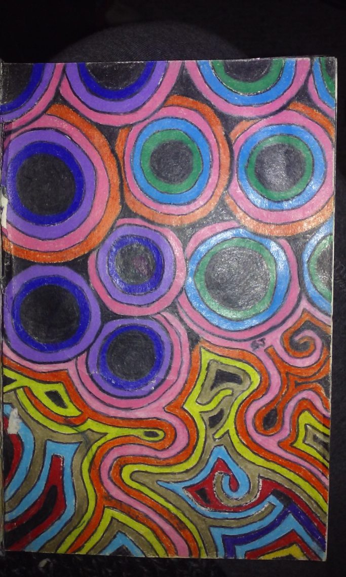 Colorful abstract design with concentric circles and swirling lines on a black background.
